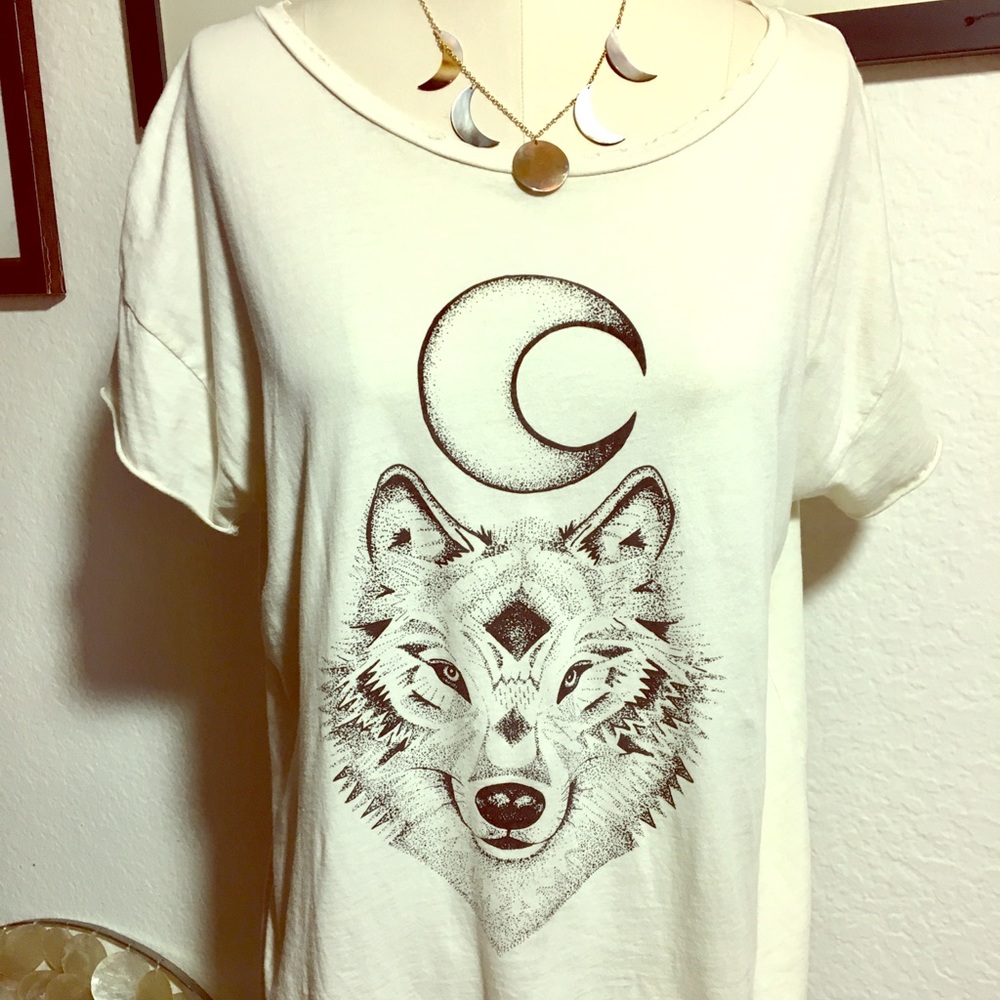 White Woman’s graphic t-shirts with moon and wolf.
